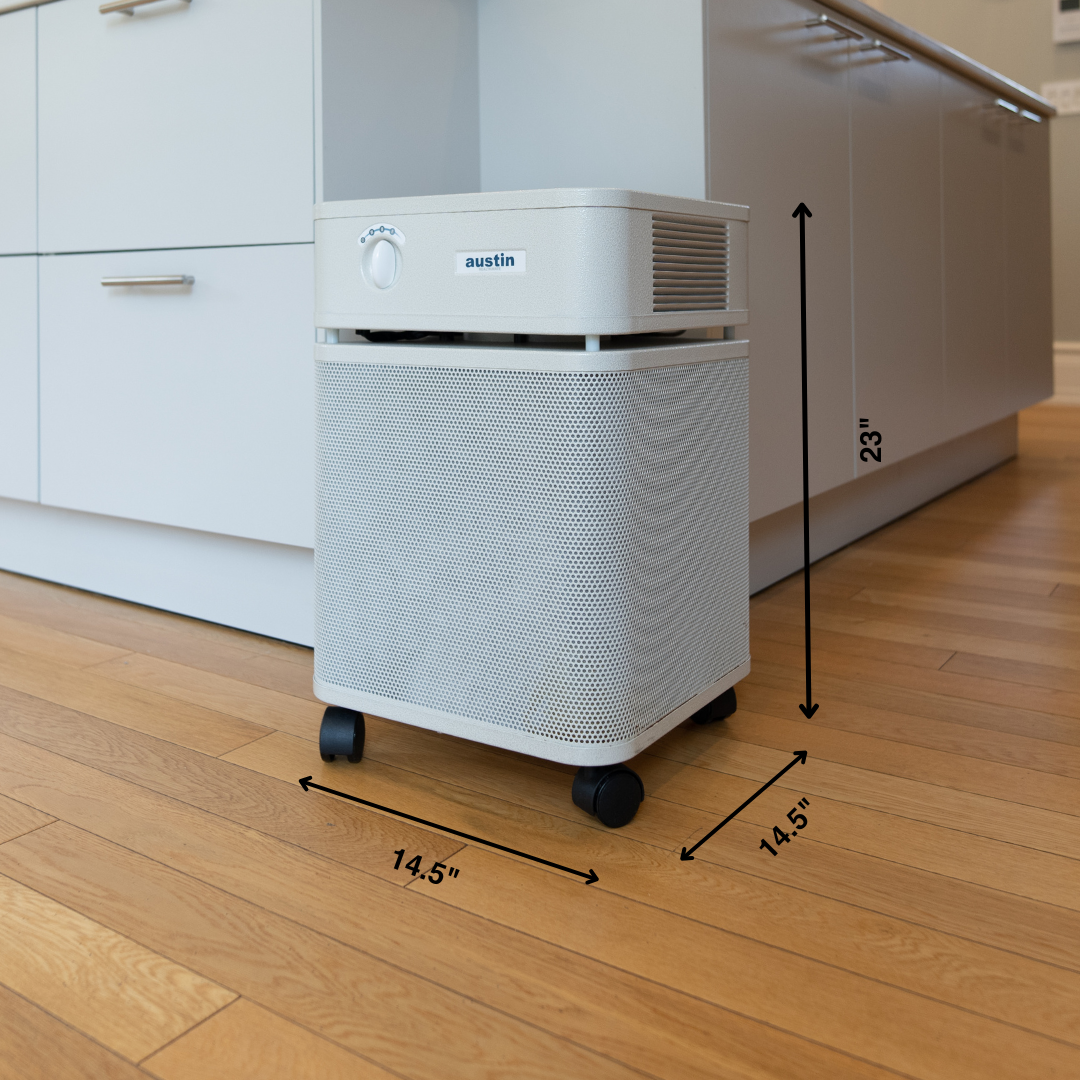 Air purifier on a wooden floor with dimensions indicated