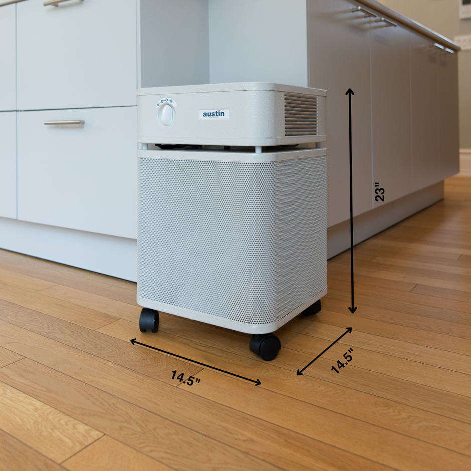 Air purifier on a wooden floor with dimensions indicated